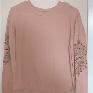 pink embroidered sweater